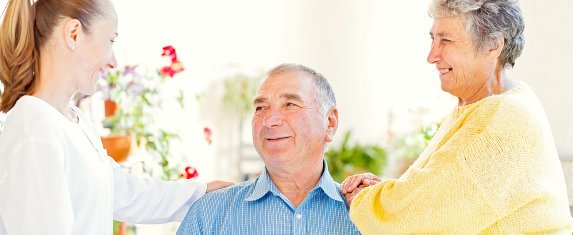 three people smiling