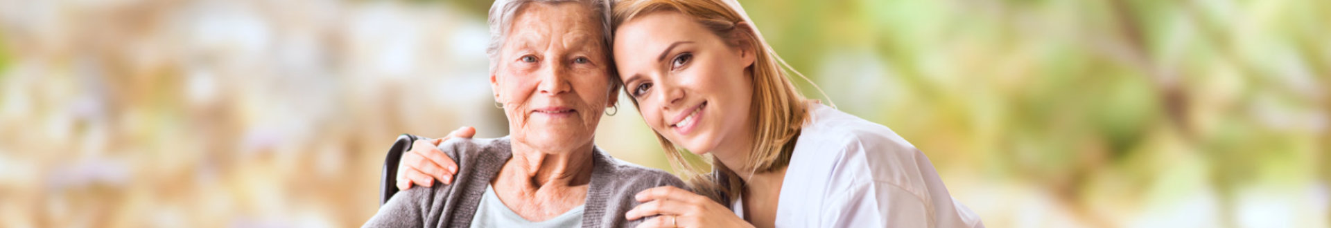 nurse and elderly woman smiling