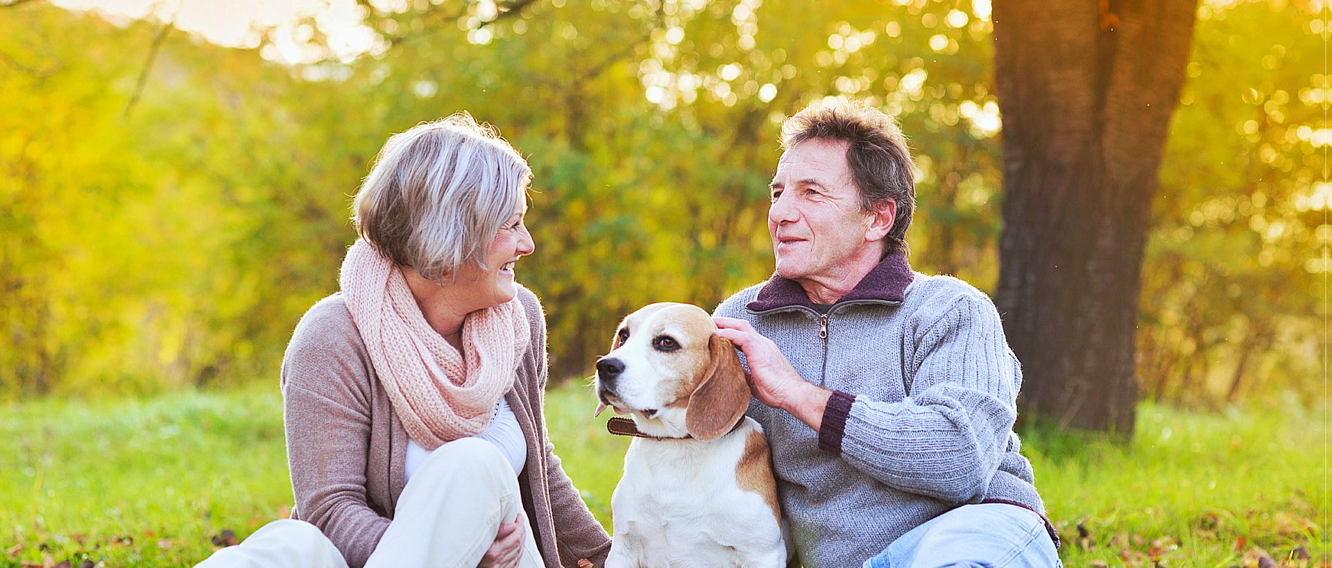 elderly couple with a dog